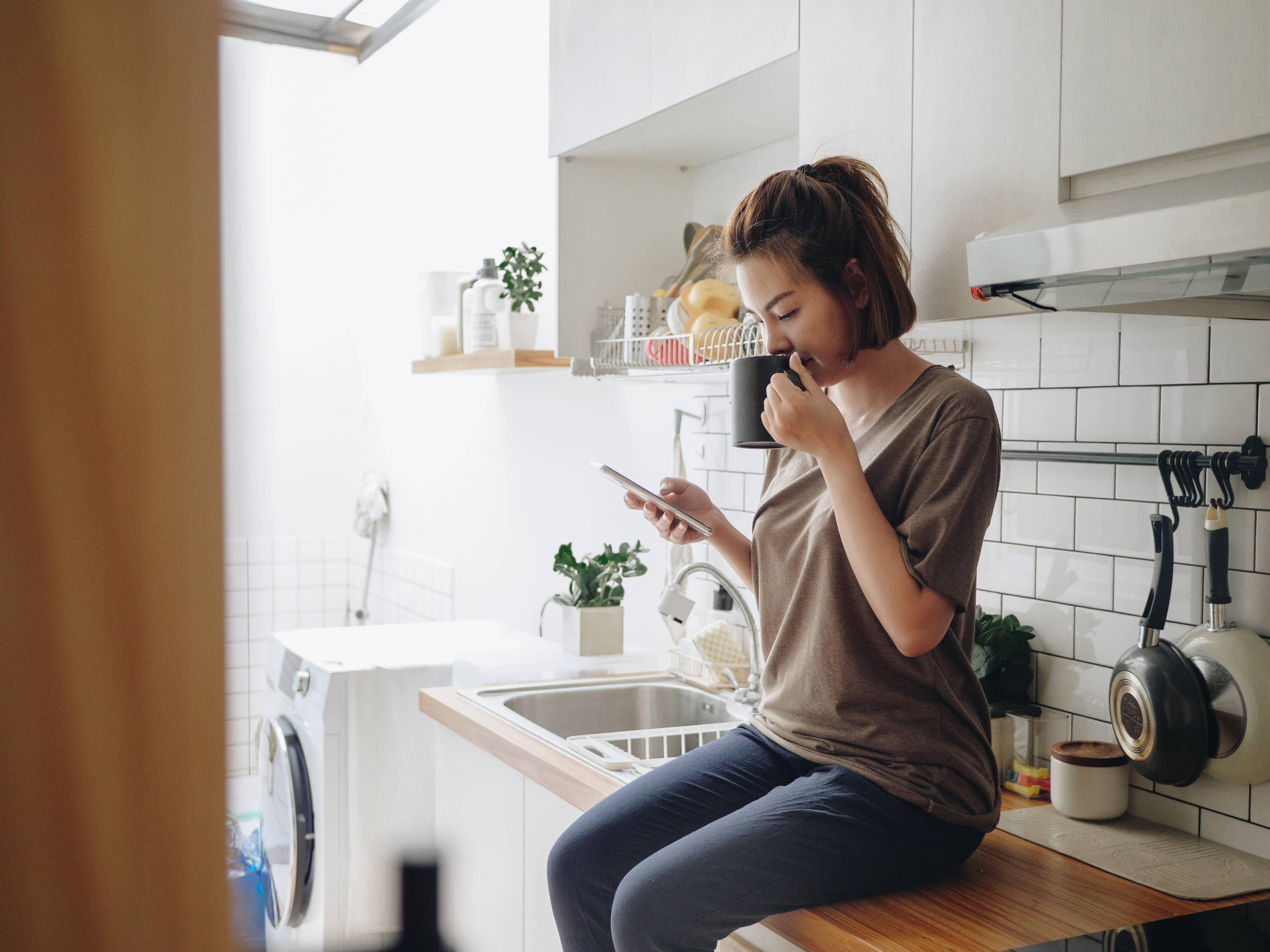 Woman sitting with cell phone